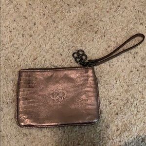 Stella & Dot small metallic clutch w/ wrist strap.